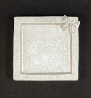 fat gjuten i formgips med rosett